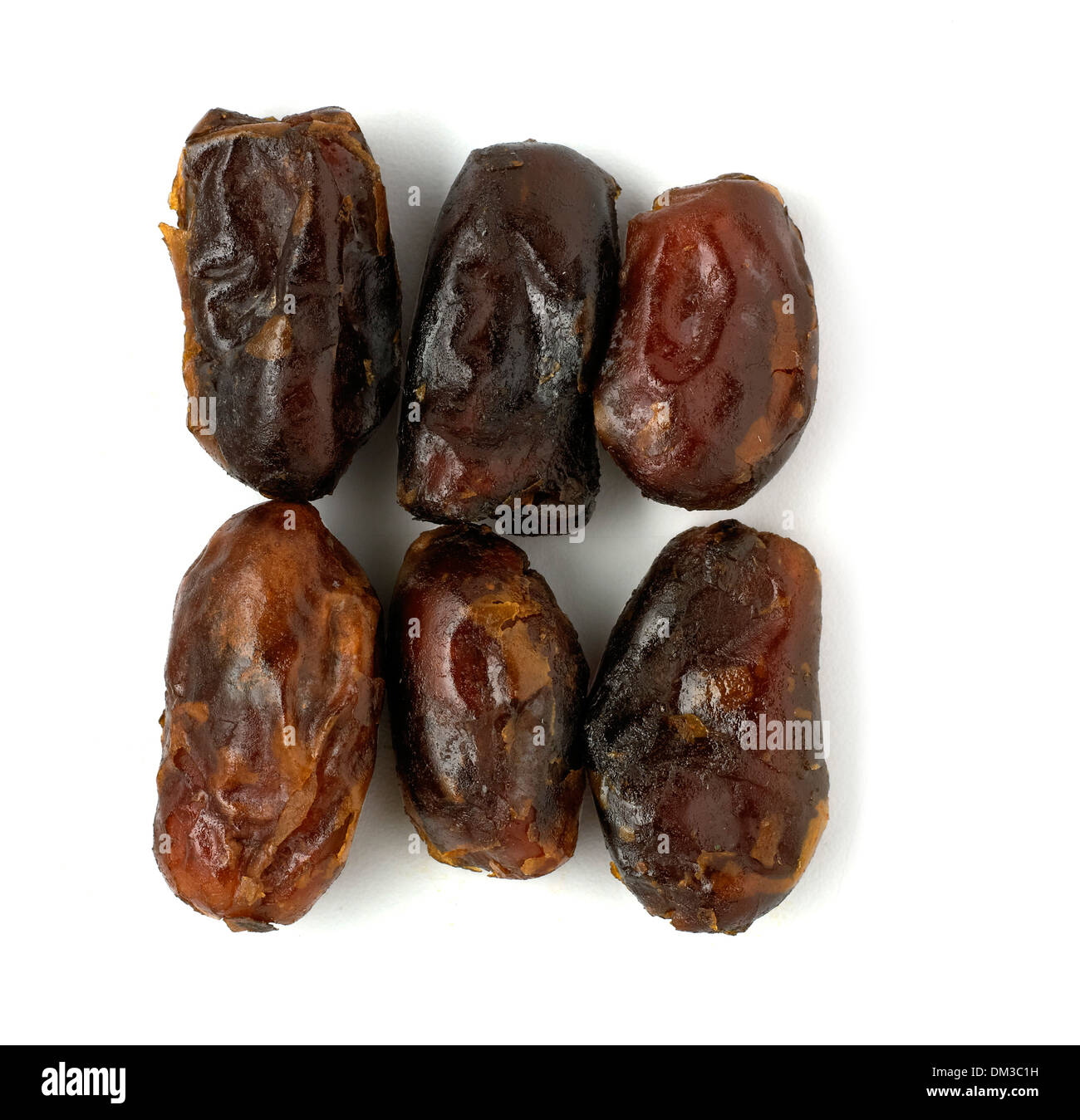 Dates cut out on white background Stock Photo