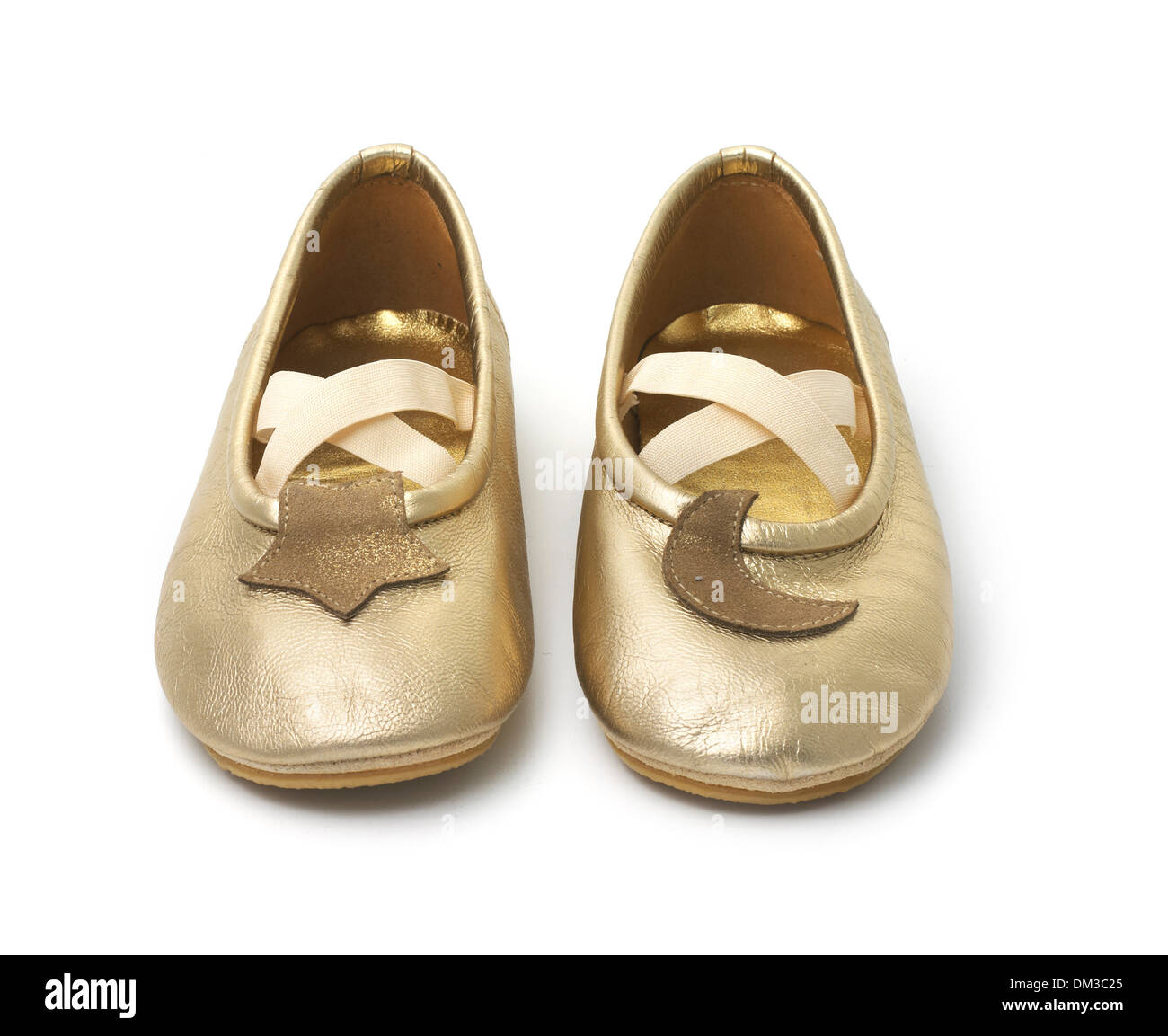 Gold ballet pumps, cut out on white background Stock Photo