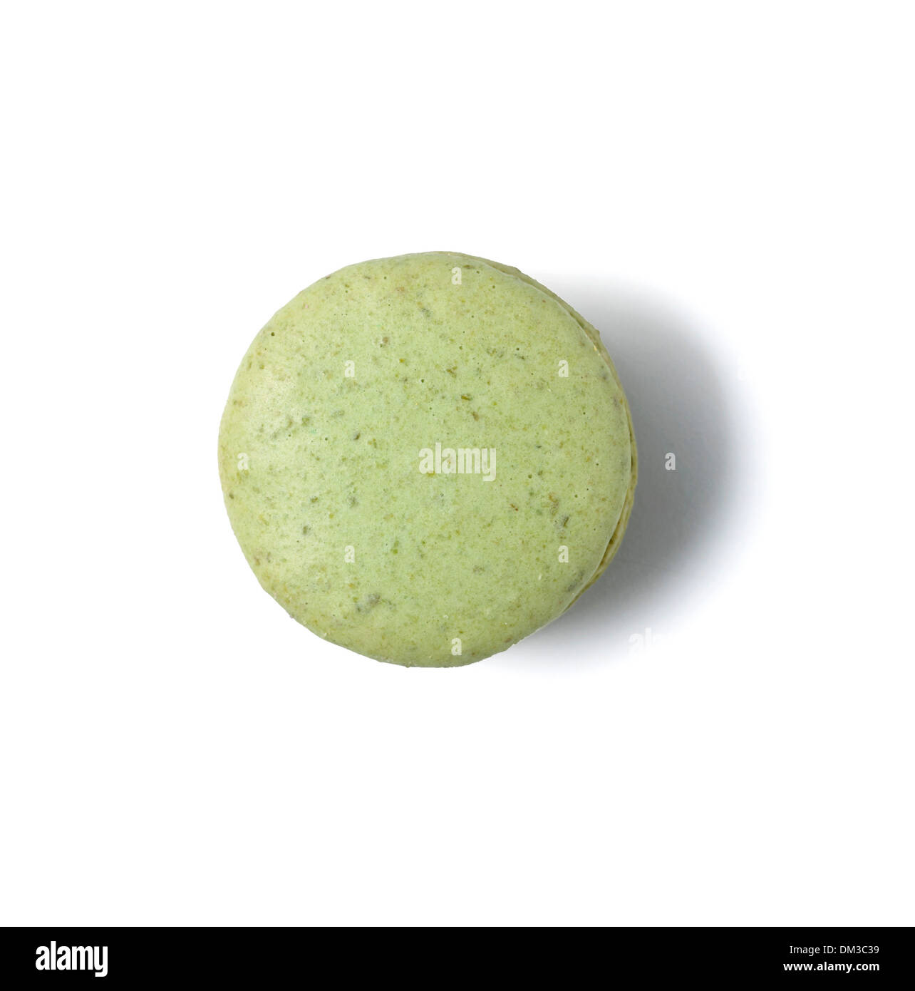 Green macaroon cut out on white background Stock Photo