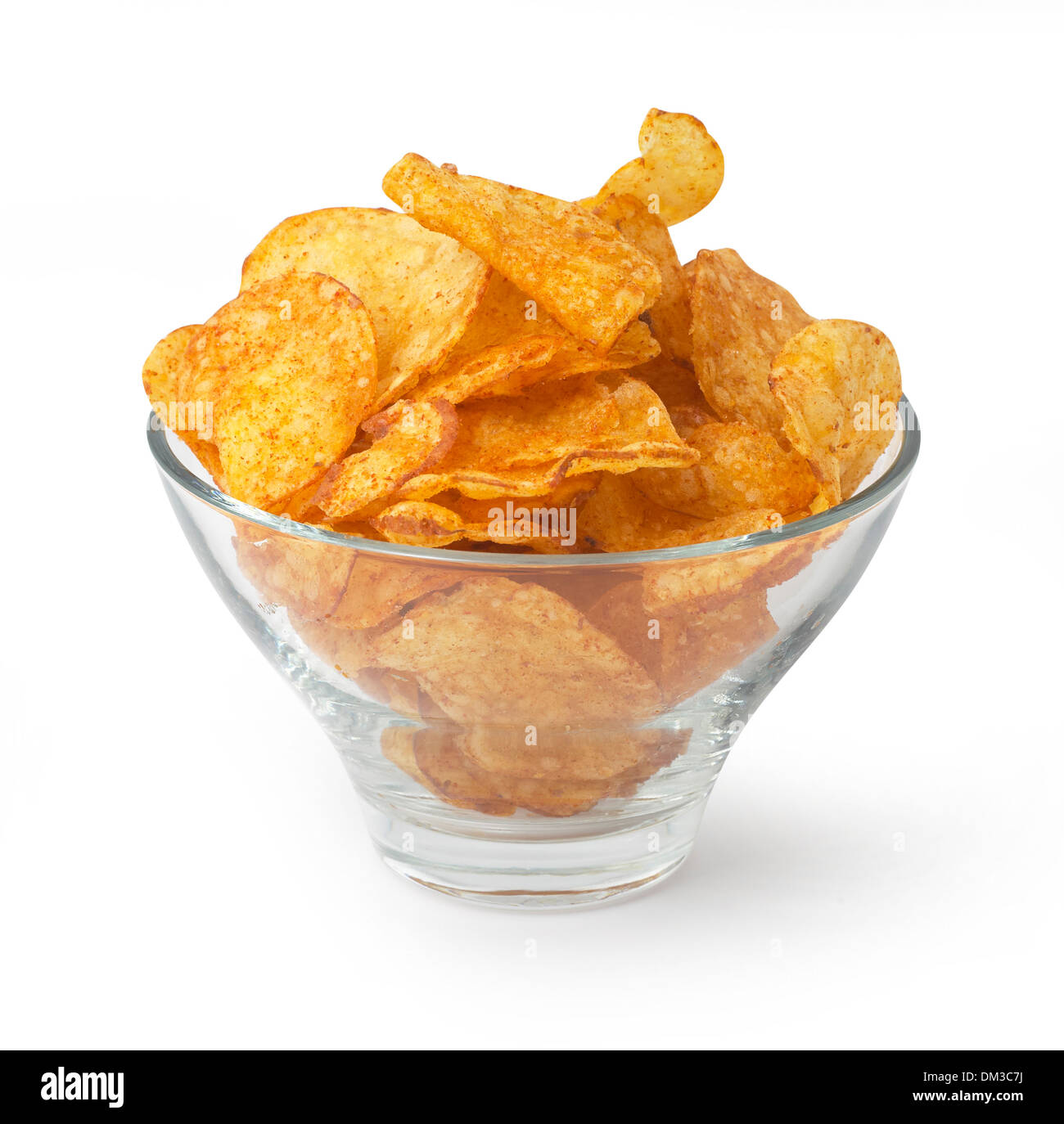 Glass bowl of crisps cut out on white background Stock Photo