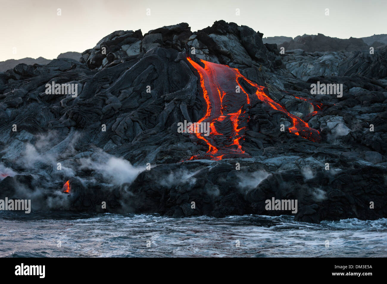 Puu Oo USA United States America Hawaii Big Island Hawaii Volcanoes National Park volcano lava sea Pacific coast steam fire Stock Photo