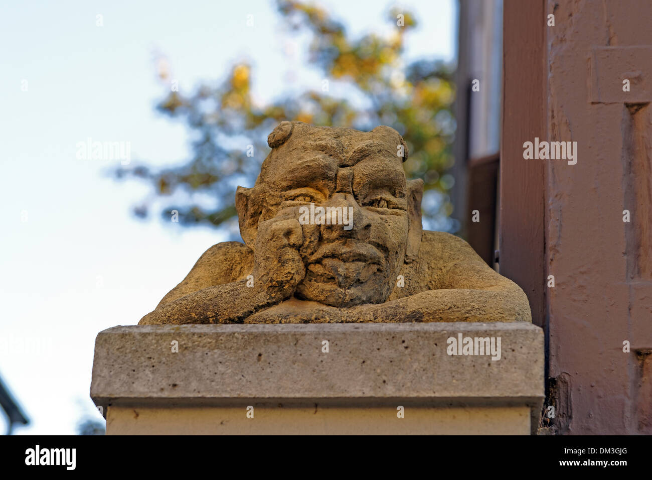 Europe Germany Lower Saxony Celle Mauernstrasse old postal court entrance pillar figures detail curiosity place of interest Stock Photo