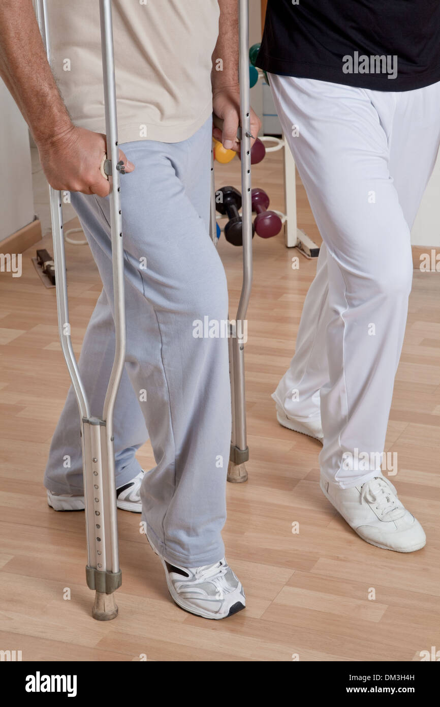 Patient on Crutches and Physician Stock Photo Alamy