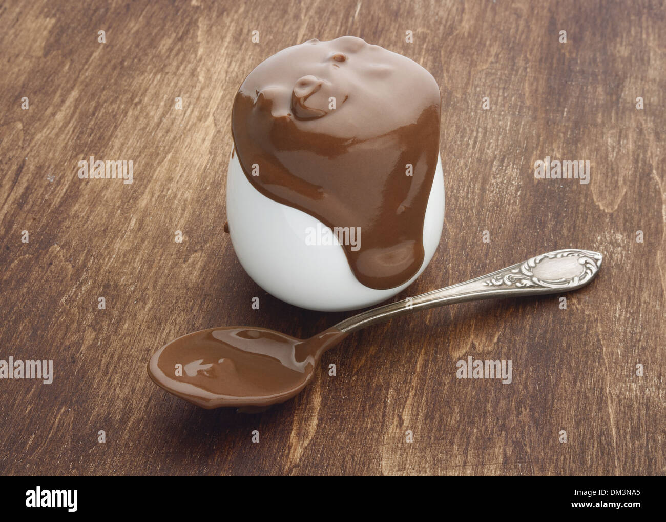 Chocolate cream on wooden background Stock Photo