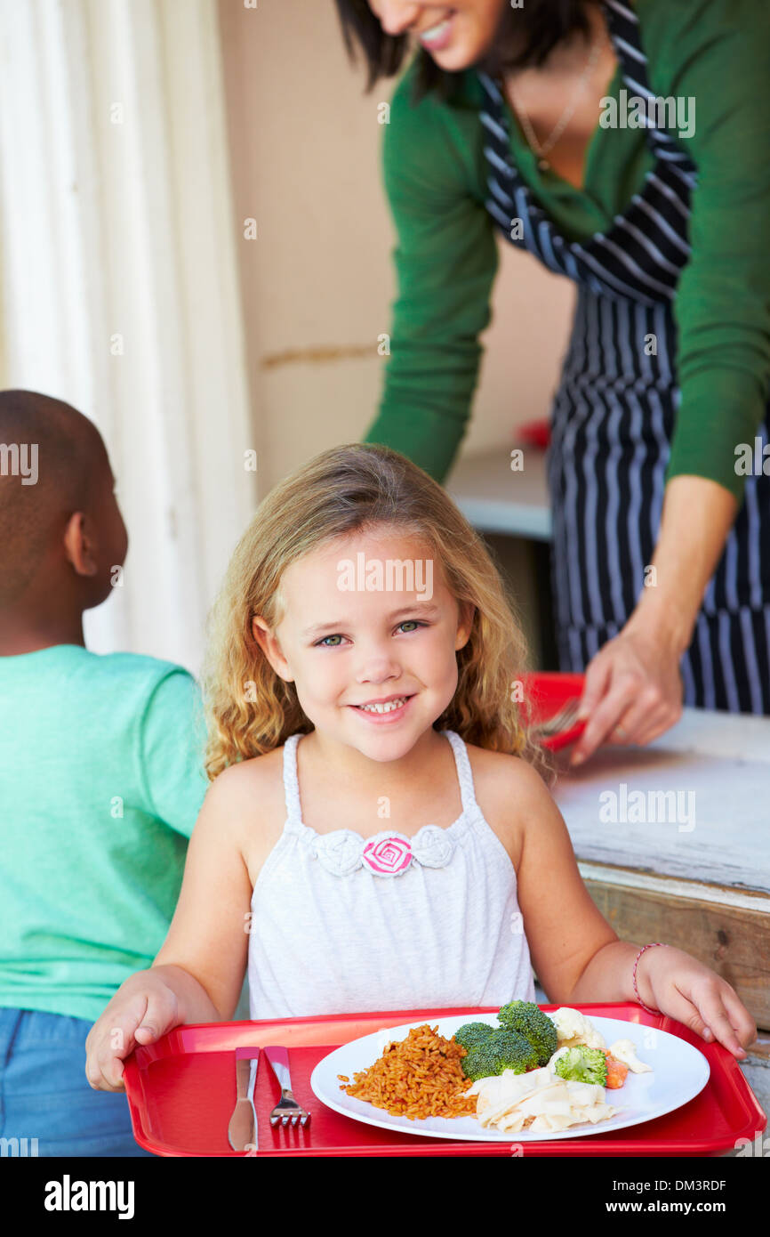 Elementary Pupil Collecting Healthy Lunch In Cafeteria Stock Photo