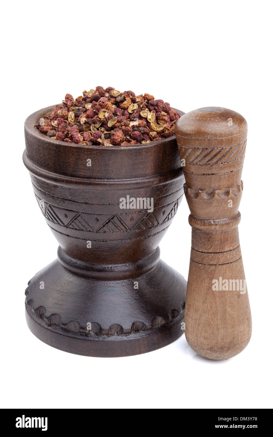 Wooden mortar full of Szechuan peppercorns - Sichuan pepper Stock Photo