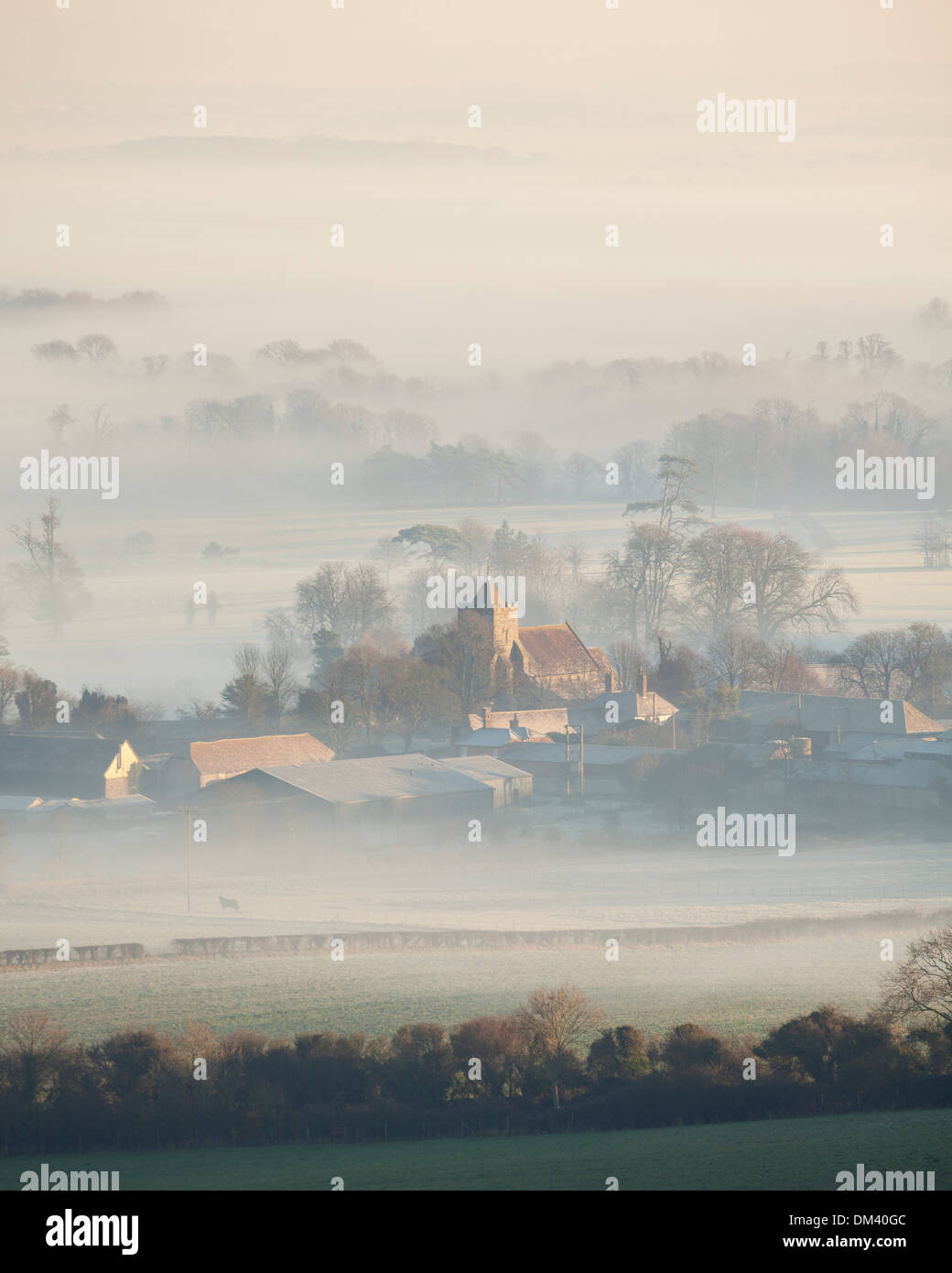 The village of Firle on a misty winter's morning. Firle, East Sussex, England, UK Stock Photo