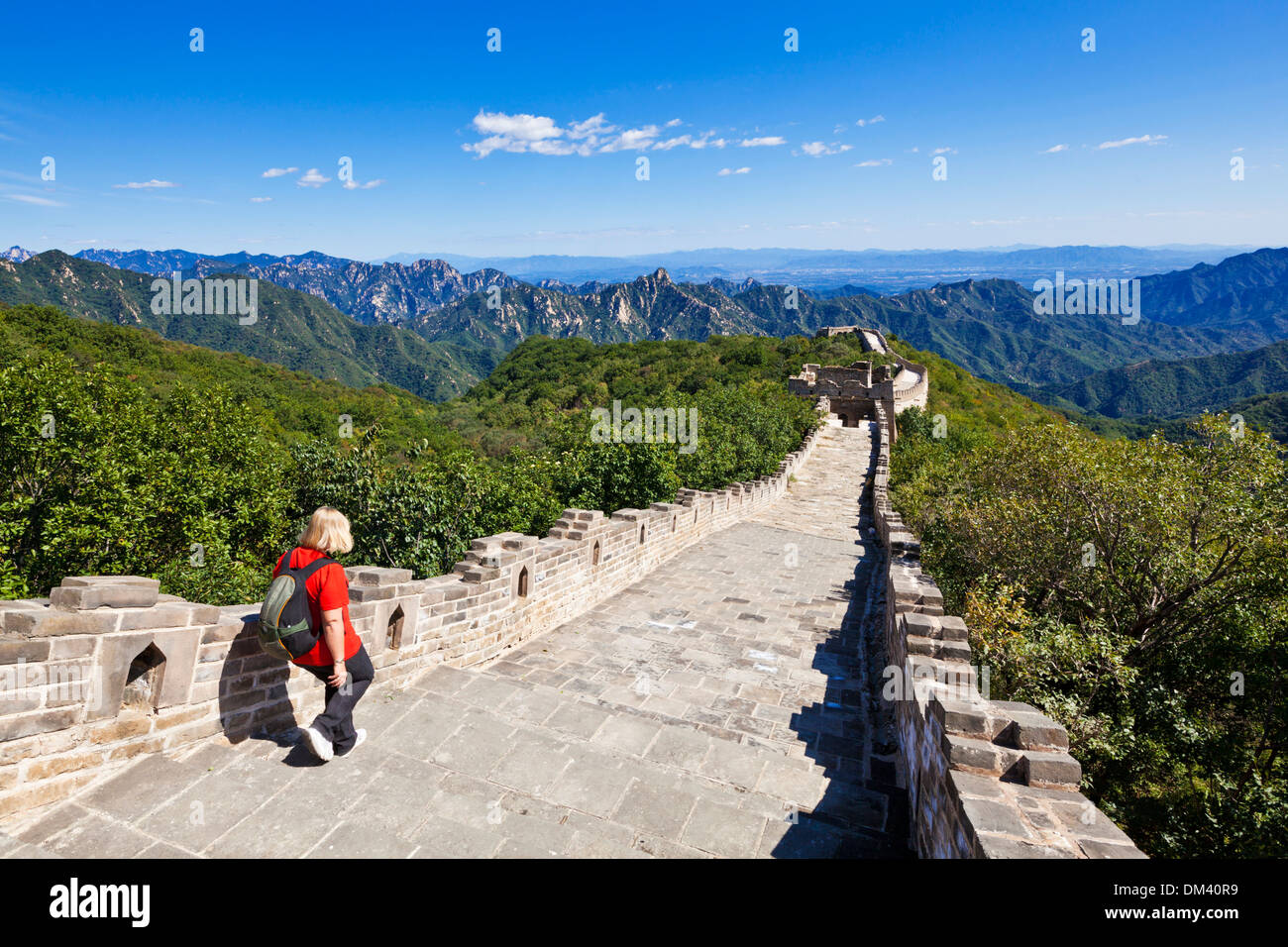 Woman Tourist walking on the Great Wall of China, UNESCO World Heritage Site, Mutianyu, Beijing District, China, Asia Stock Photo