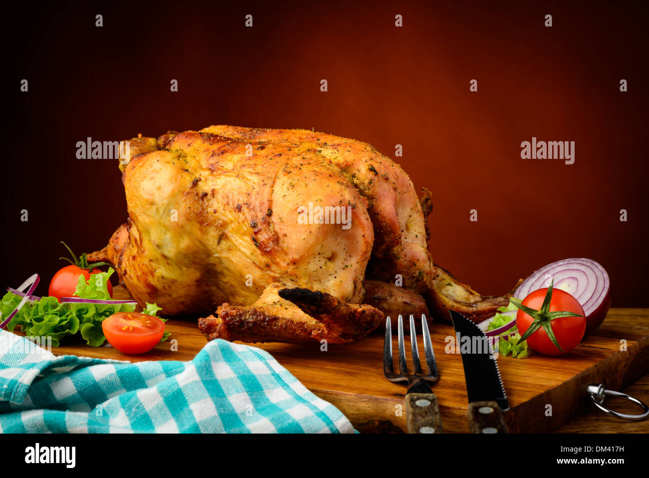still life with traditional homemade grilled chicken on a wooden plate ...
