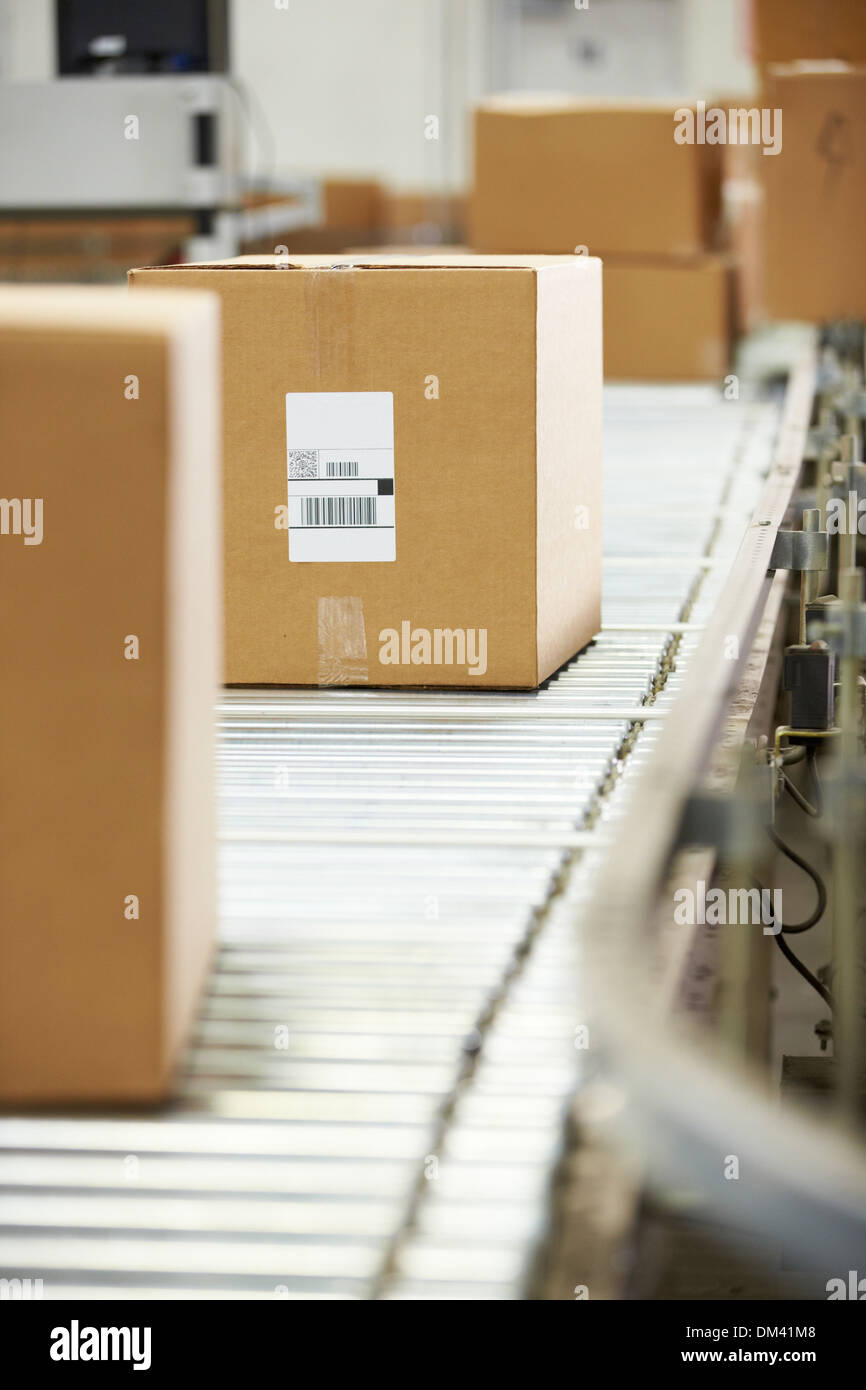 Goods On Conveyor Belt In Distribution Warehouse Stock Photo