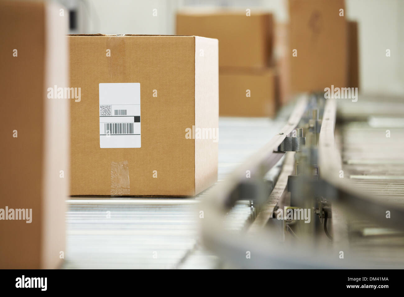 Goods On Conveyor Belt In Distribution Warehouse Stock Photo