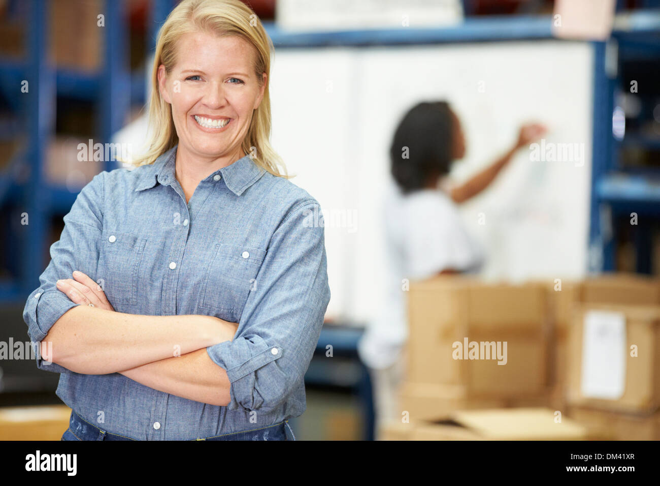 Portrait Of Worker In Distribution Warehouse Stock Photo