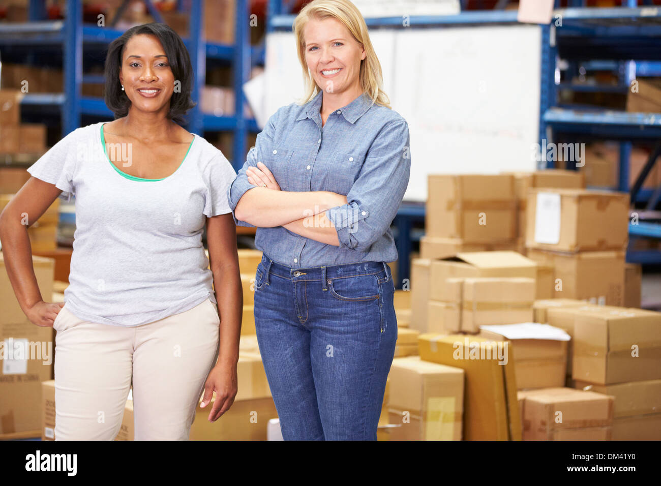 Portrait Of Workers In Distribution Warehouse Stock Photo