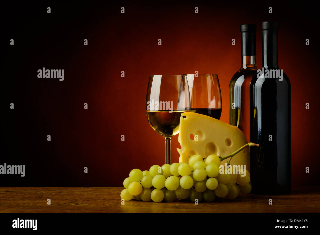 still life with cheese, grapes, red and white wine Stock Photo - Alamy