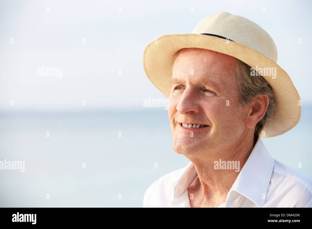 Senior Man On Tropical Beach Holiday Stock Photo