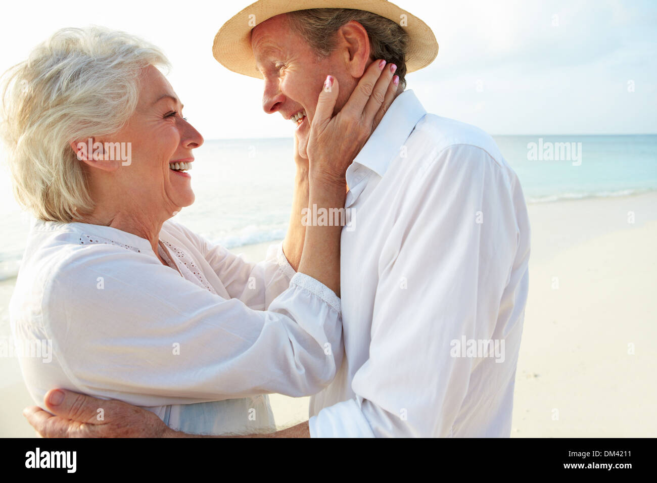 Affectionate Senior Couple On Tropical Beach Holiday Stock Photo