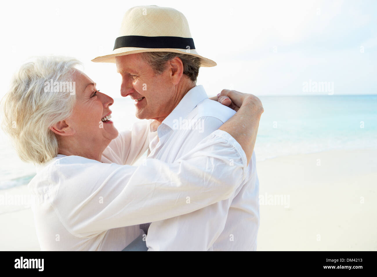 Affectionate Senior Couple On Tropical Beach Holiday Stock Photo