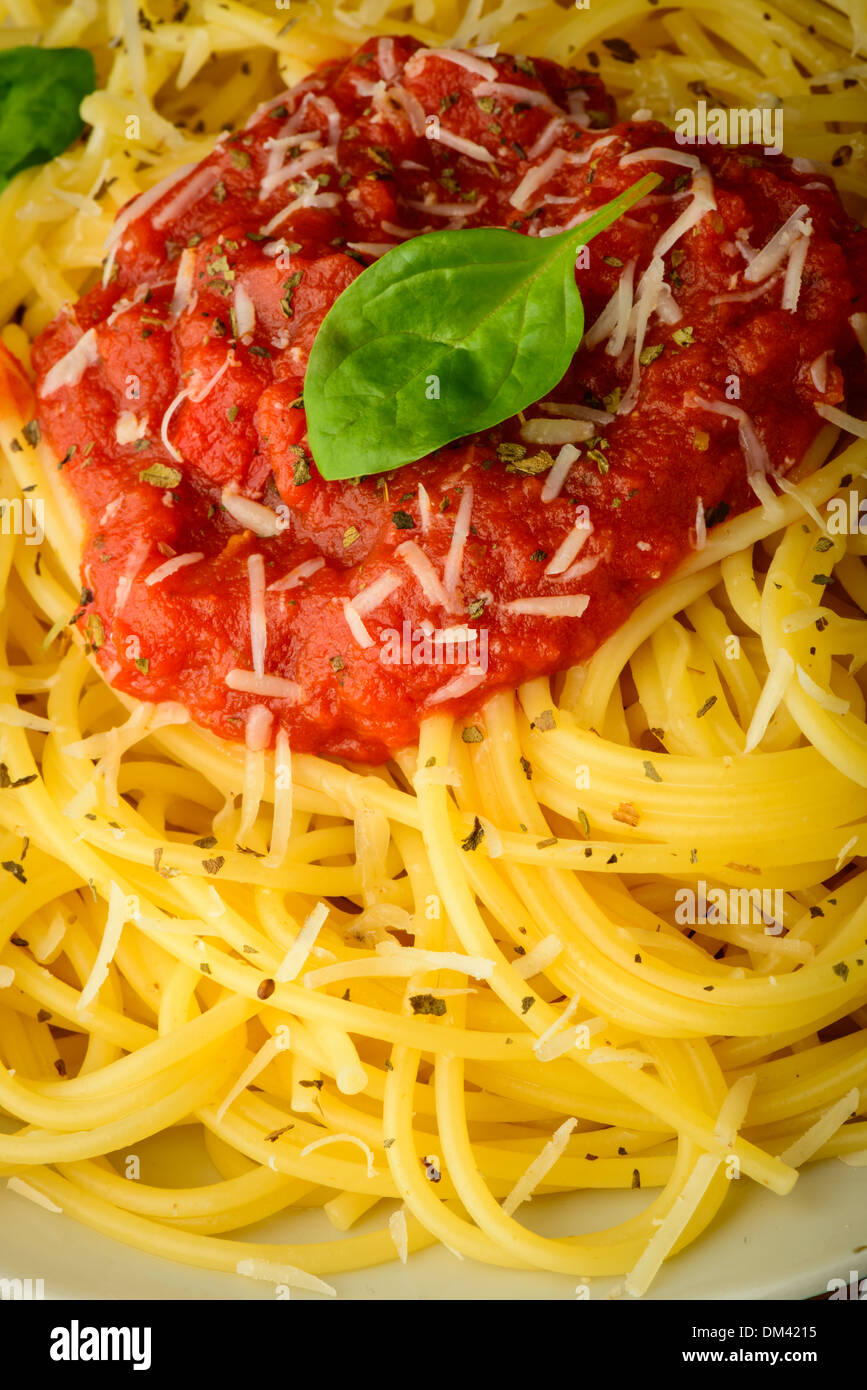 traditional italian pasta closeup with tomato sauce and basil Stock Photo
