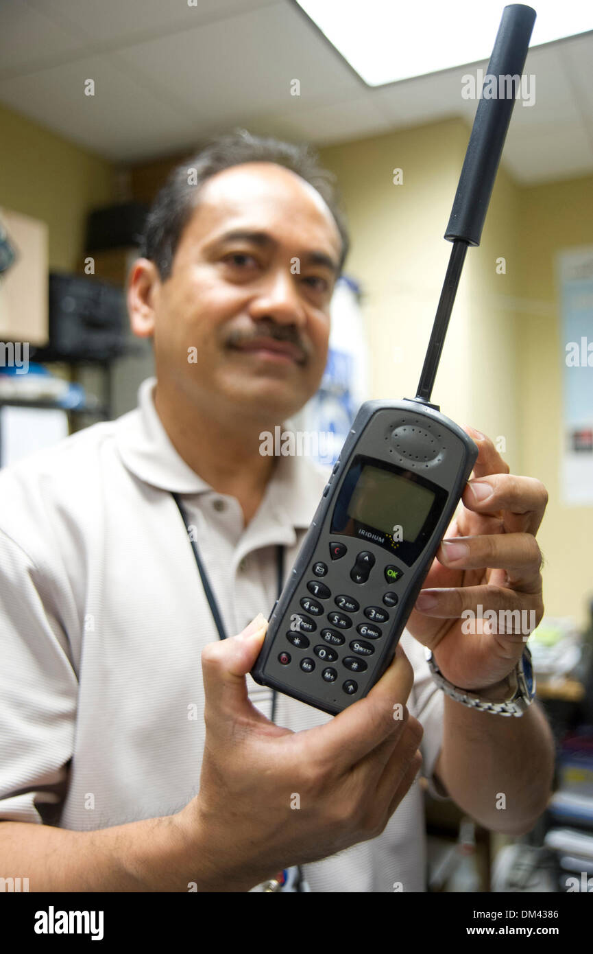 Aug. 28, 2013 - Atlanta, Georgia, USA - August 28, 2013, Atlanta, Georgia - A member of the Center for Disease Control's (CDC) Logistics Support Branch (LSB) shows off a iridium phone that can be sent with CDC staff anywhere in the world during emergency responses or everyday work. (Credit Image: © David Snyder/ZUMAPRESS.com) Stock Photo