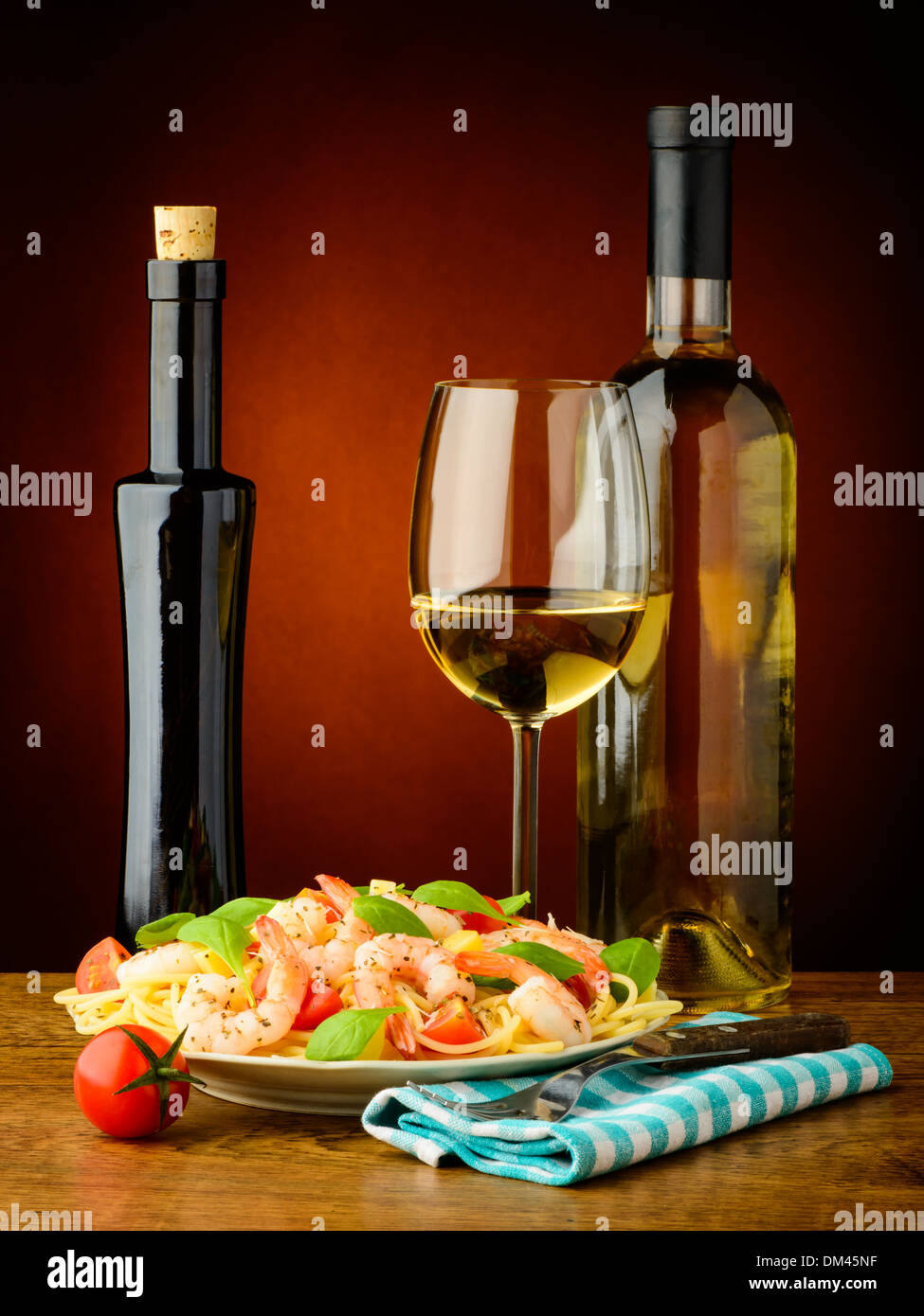 still life with spaghetti pasta with shrimps and white wine Stock Photo