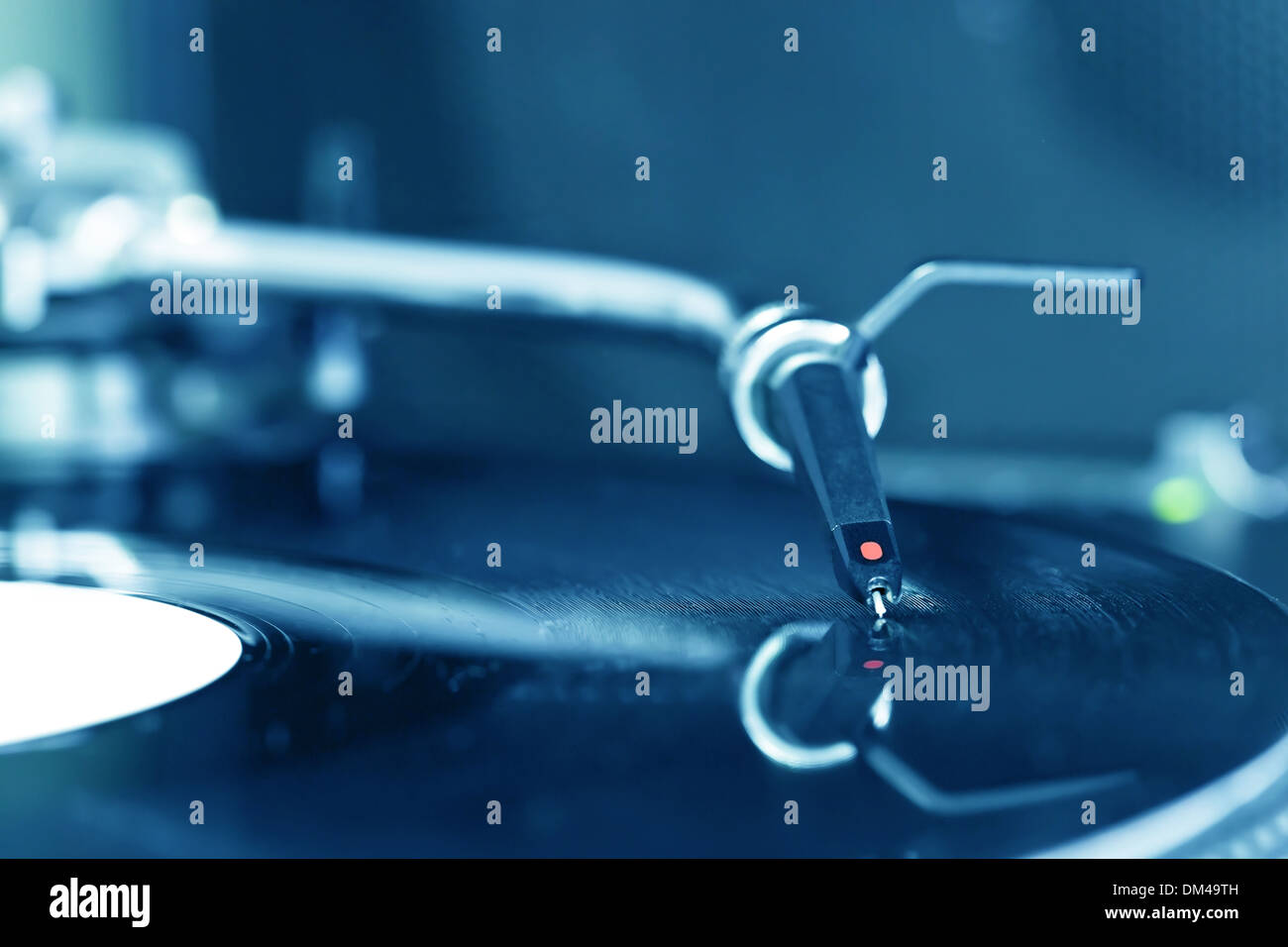 Dj turntable needle and on vinyl record Stock Photo Alamy