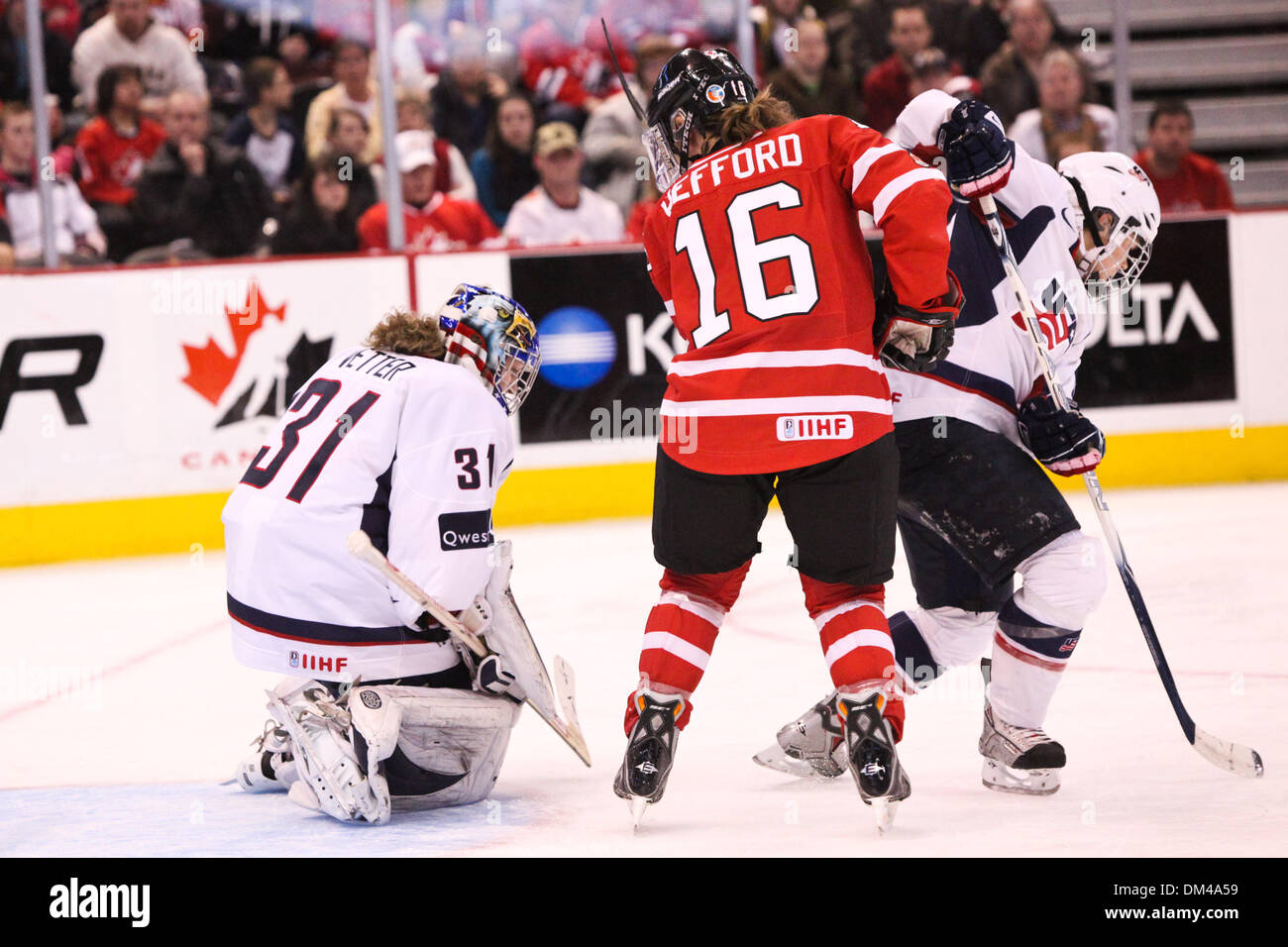 Quest Tour - Team USA's Goaltender Jessie Vetter (31) makes a save during the 2nd period as Team Canada's Jayna Hefford (16) and Team USA's Caitlin Cahow (8) tangle up. Both teams are tied a goal each at the end of the period. The game was held at Scotiabank Palace in Ottawa, Ontario, Canada. (Credit Image: © Nicholas Serrata/Southcreek Global/ZUMApress.com) Stock Photo