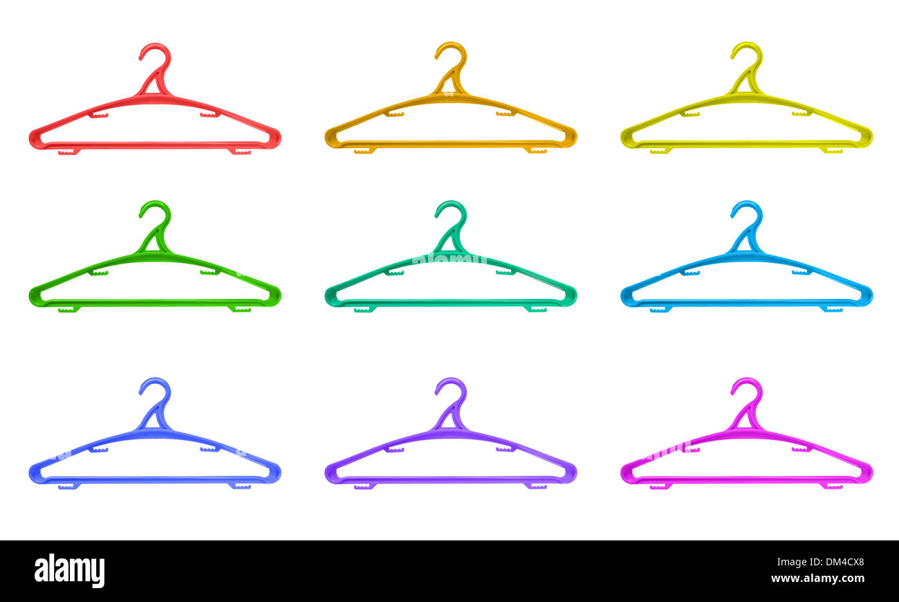 Plastic hangers of various colours over white background Stock Photo