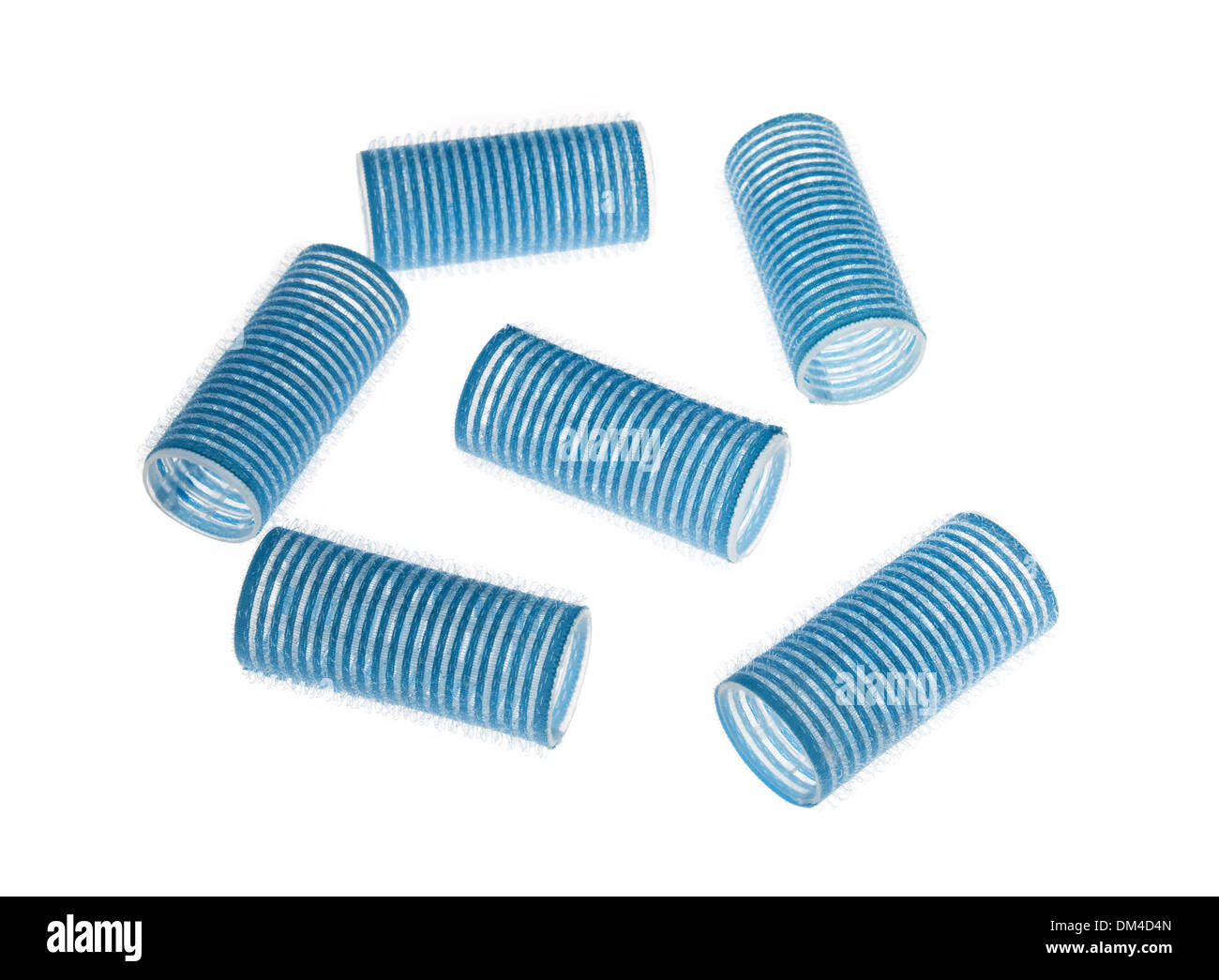 Blue hair curlers isolated over white background Stock Photo