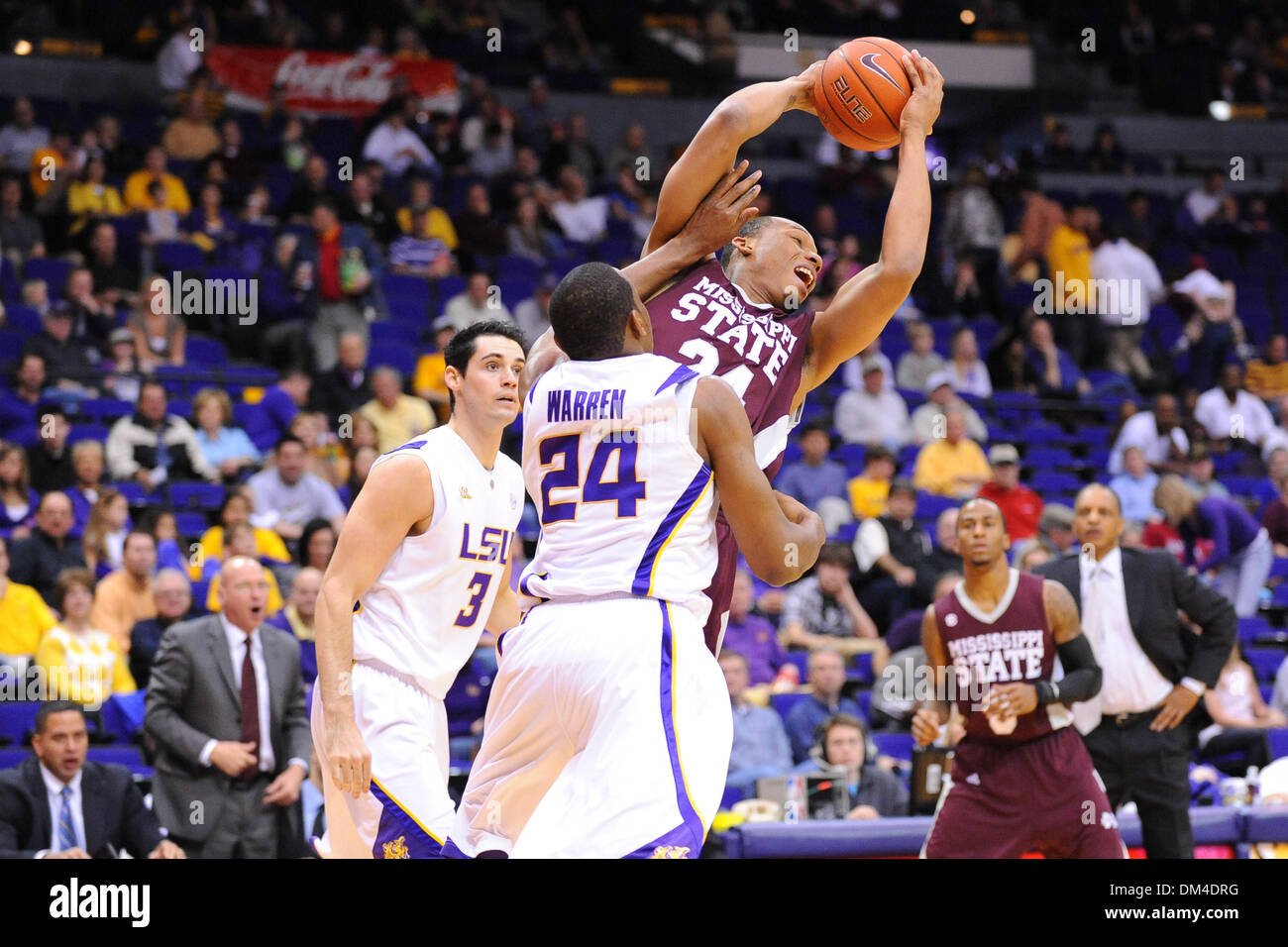 Miss. State forward, #24 Kodi Augustus, is fouled by LSU forward, #24 ...