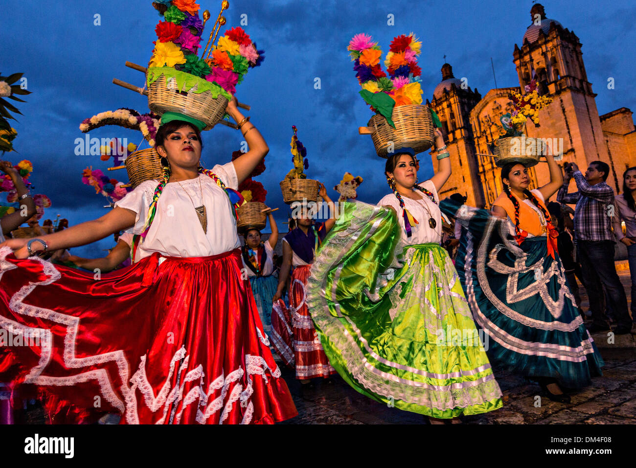 Young women dressed in traditional costumes parade in a comparsas past