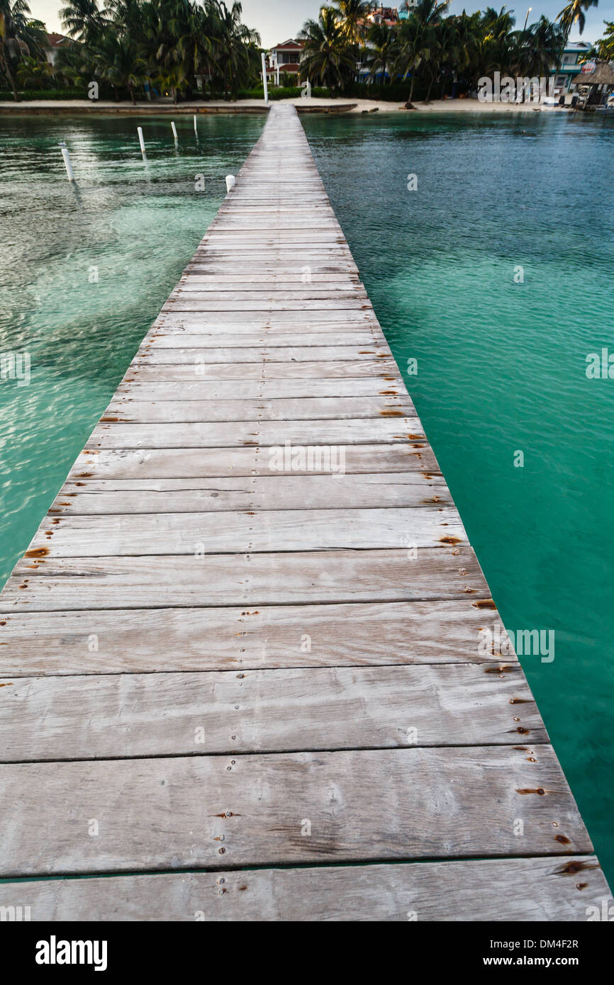 Long dock at resort in pretty, clear, tropical waters of Caribbean Sea Stock Photo