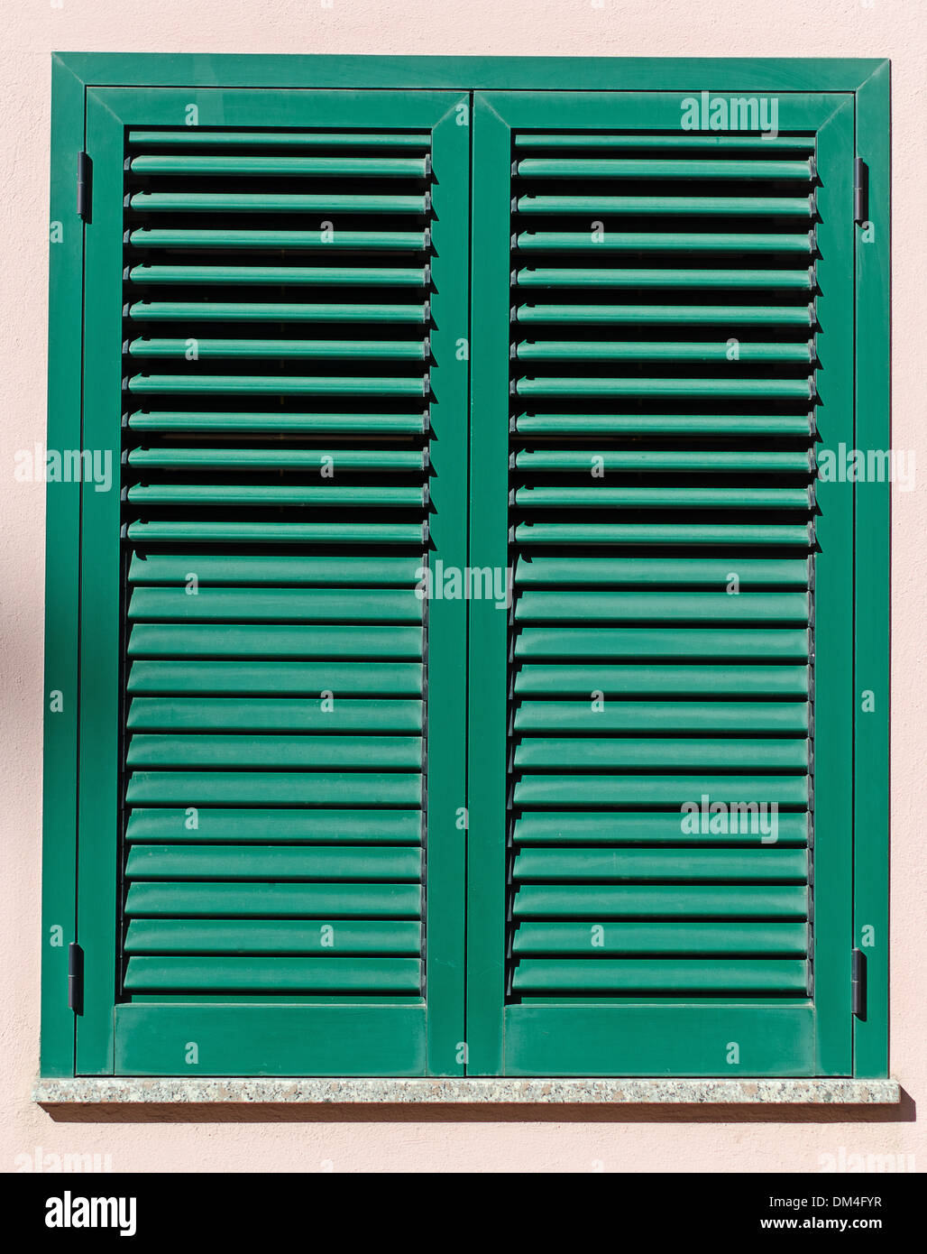 Window with green shutters Stock Photo