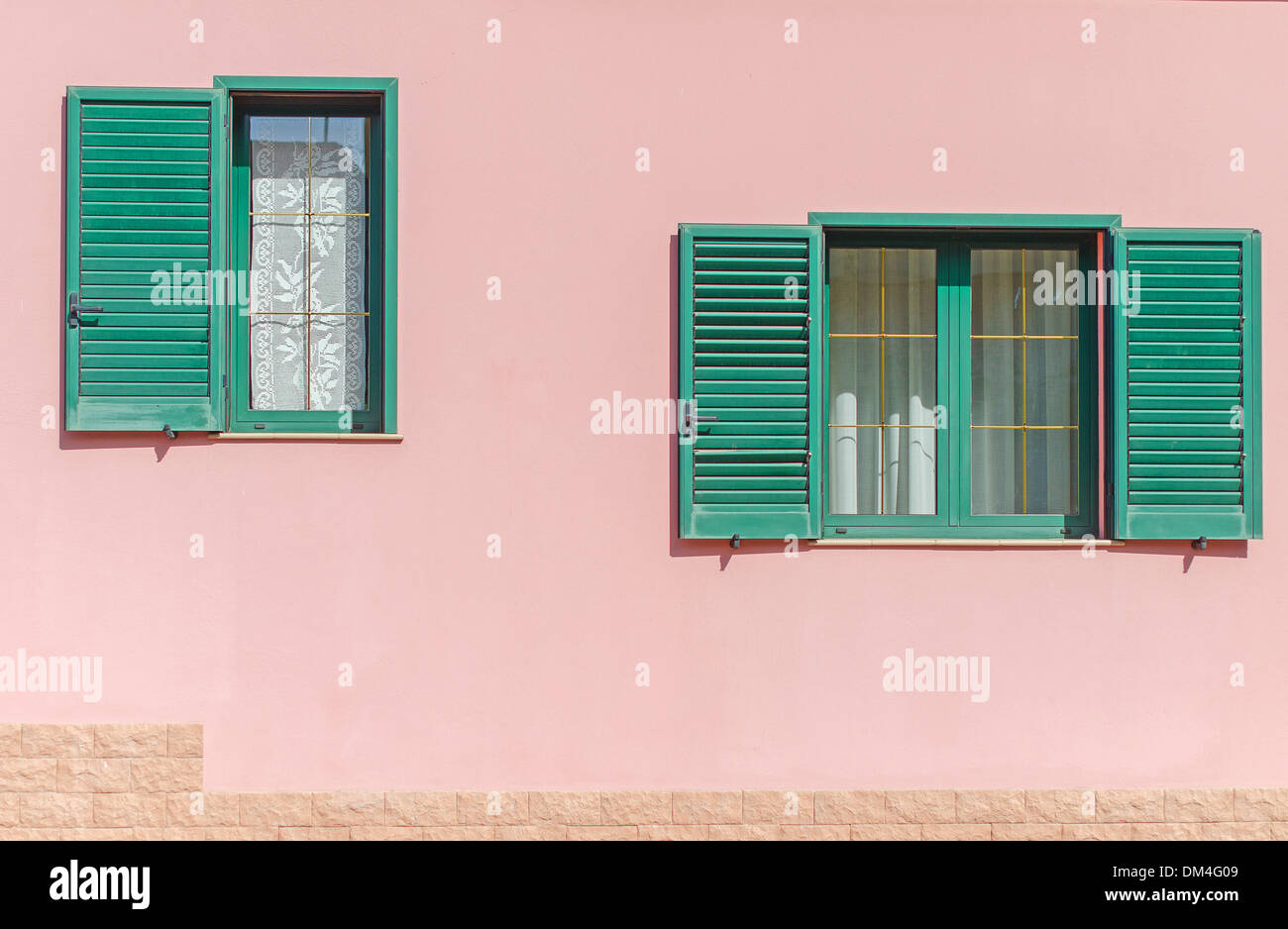 Two window with open green shutters Stock Photo