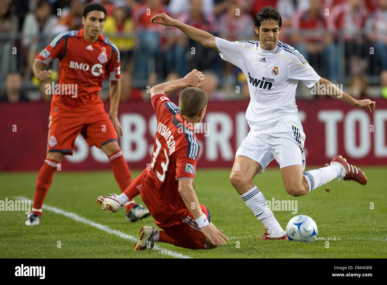 Real Madrid Midfielder Kaka 8 And Toronto Fc Midfielder Carl Robinson 33 In Action At Bmo Field In Toronto During A Fifa Friendly Soccer Match The Final Score Was 5 1 For Real Madrid For