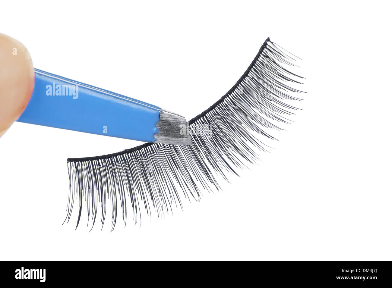 False lashes and blue pincers, closeup on white background  Stock Photo