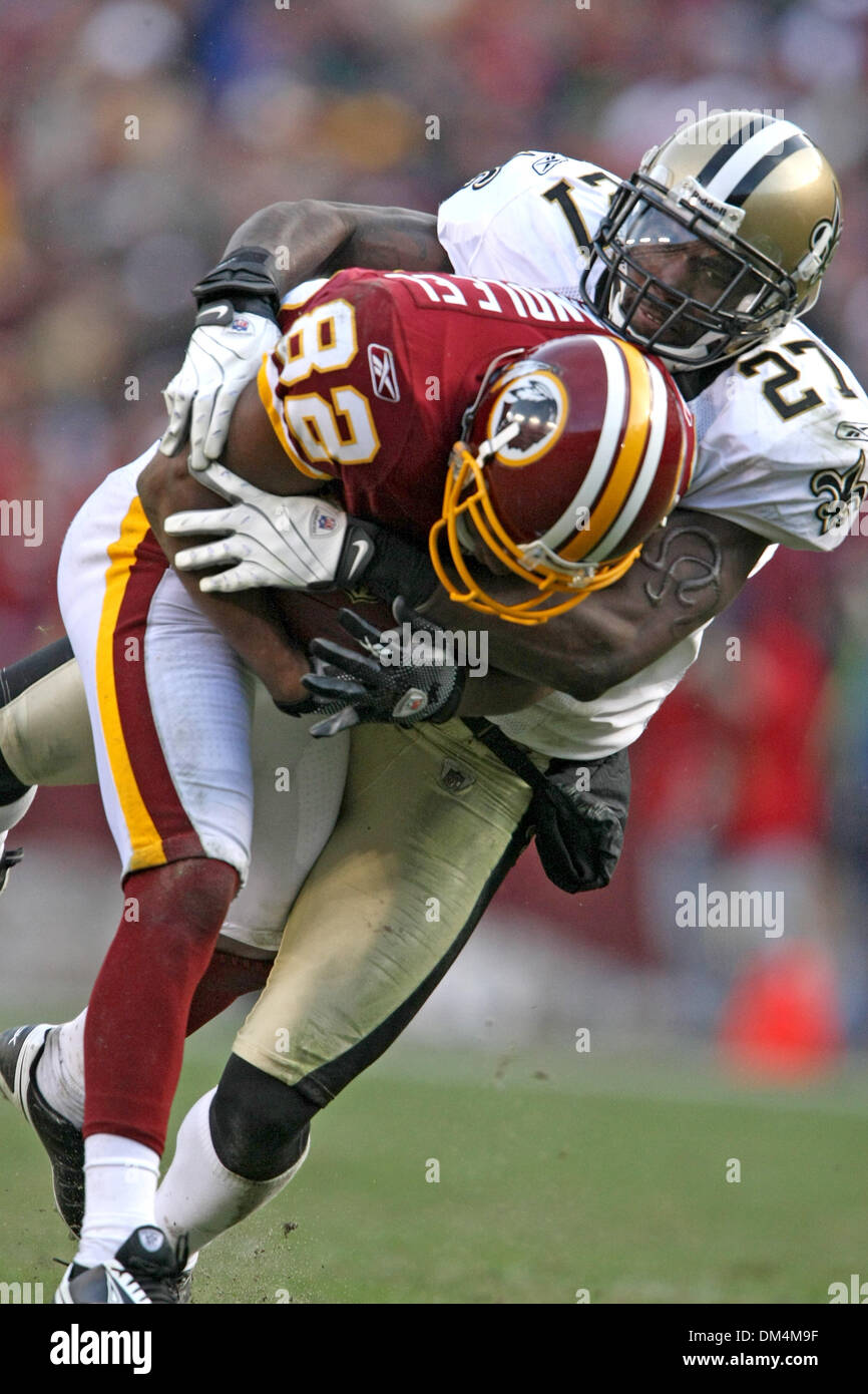 Dec. 6, 2009 - Hyattsville, Maryland, U.S - 06 December 2009:  Washington Redskins wide receiver Antwaan Randle El #82 is tackled by New Orleans Saints cornerback Malcolm Jenkins #27 during the NFL football game between the New Orleans Saints and the Washington Redskins at FedEx Field in Hyattsville, Maryland.  The Saints defeated the Redskins in overtime 33-30..Mandatory Credit -  Stock Photo