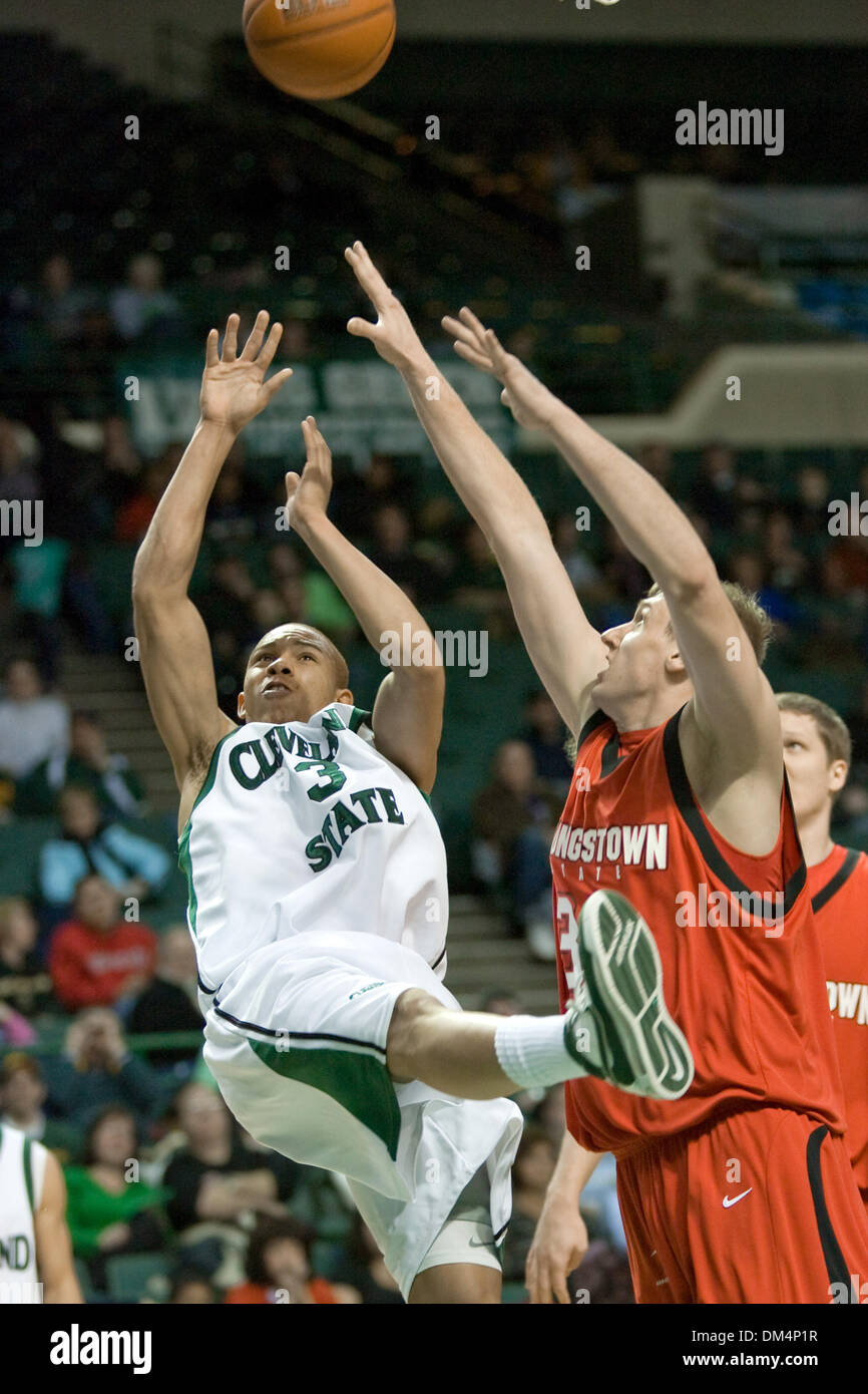 30 January 2010:  Cleveland State Vikings Trevon Harmon (3) is fouled on his way to the basket by Youngstown State Penguins Dan Boudler (33) during the NCAA college basketball game between the Youngstown State Penguins and the Cleveland State Vikings at the Wolstein Center on the campus of Cleveland State University in Cleveland, Ohio.  Cleveland State defeated Youngstown State 77- Stock Photo