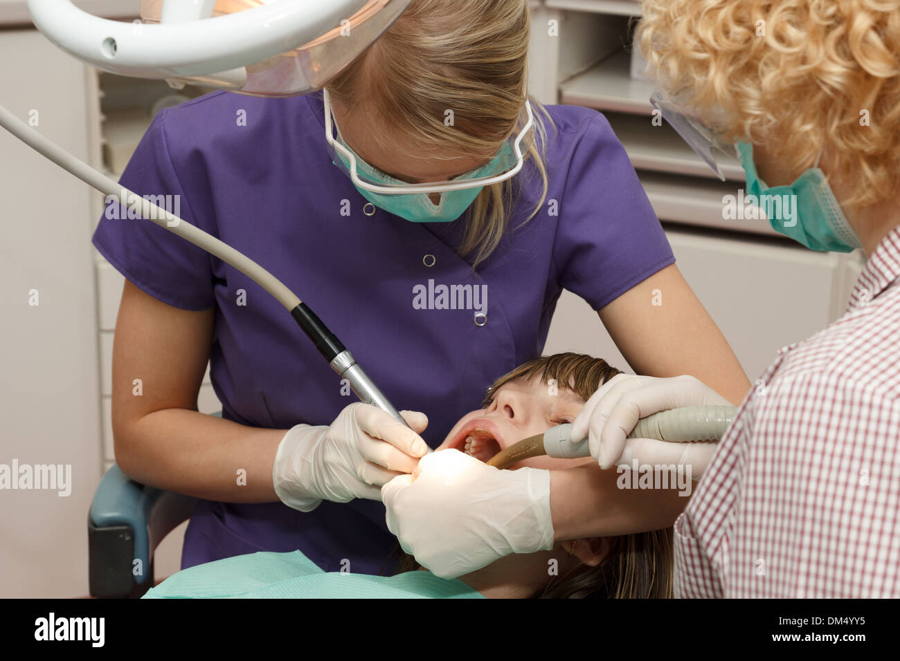 dentist and asistant work. drilled teeth Stock Photo Alamy