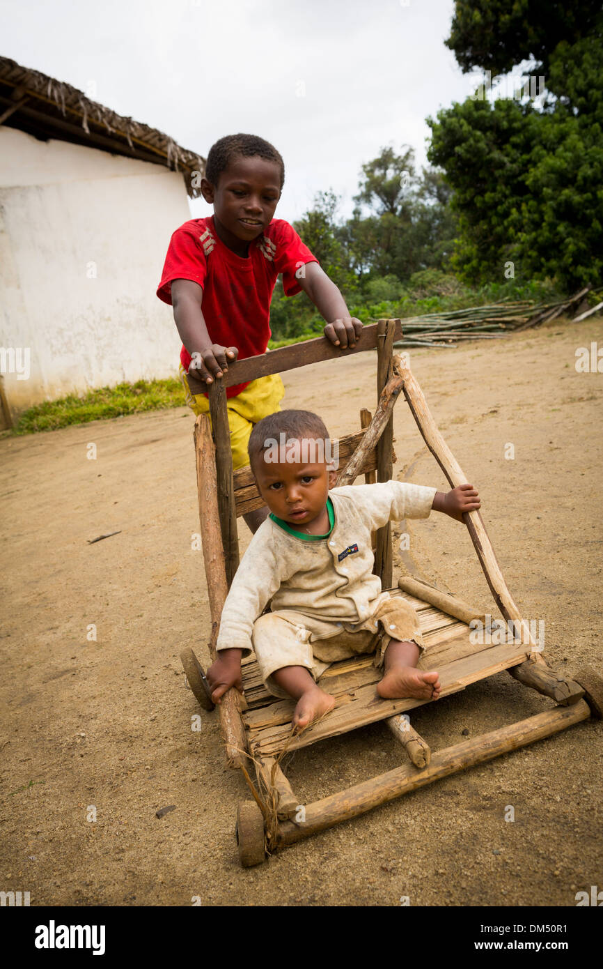 Children playing with a homemade pram 