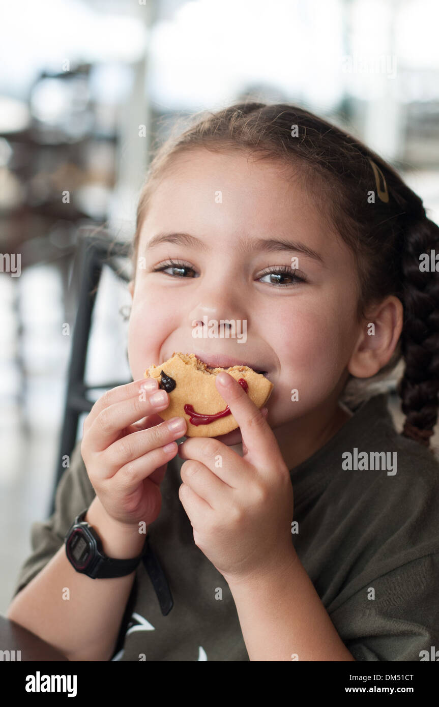 Child eating cookie Stock Photo