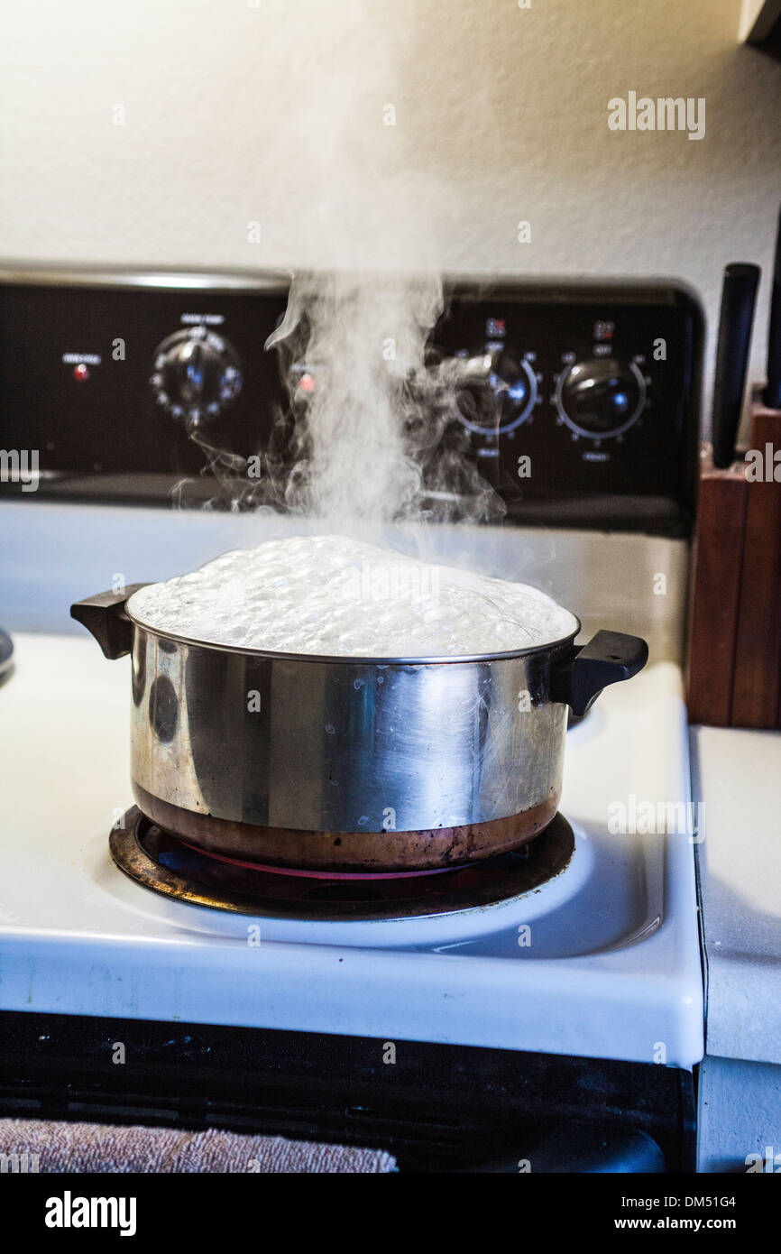 A steaming Pot of boiling water Stock Photo