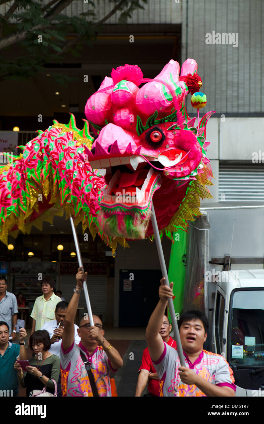 Traditional dragon dance as part of the Chinese New Year celebrations, Chinatown, Singapore. Stock Photo