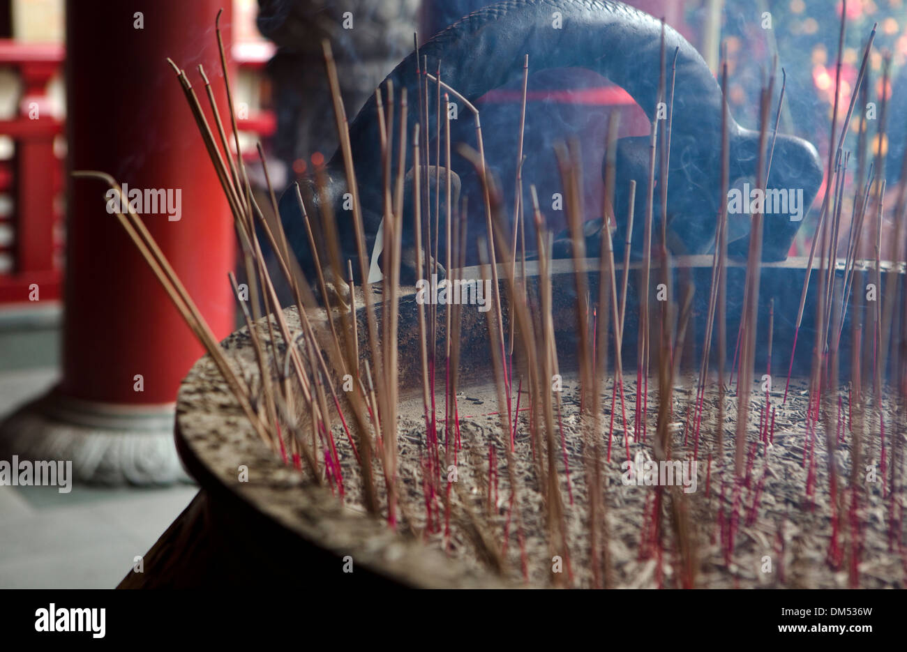 Incense burning in an urn at the Buddha Tooth Relic Temple and Museum