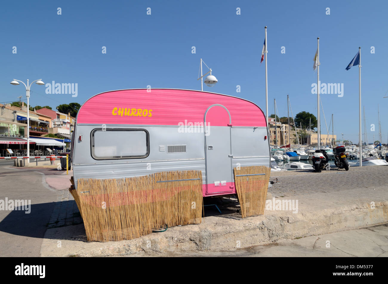 Pink Caravan used as Fast Food Stall or Food Truck Selling Churros on the Port Carry-le-Rouet Provence France Stock Photo
