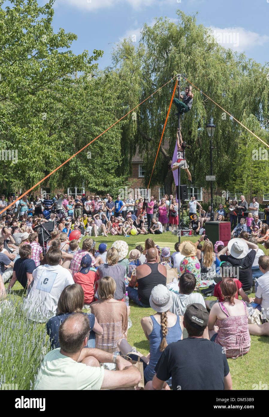 Performers in Abbey Gardens at the Winchester Hat Fair in Hampshire