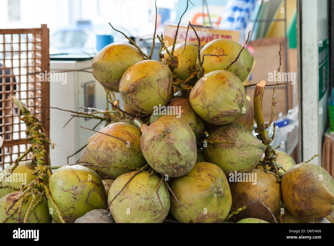 Fresh coconuts for sale in a street market, Singapore Stock Photo Alamy