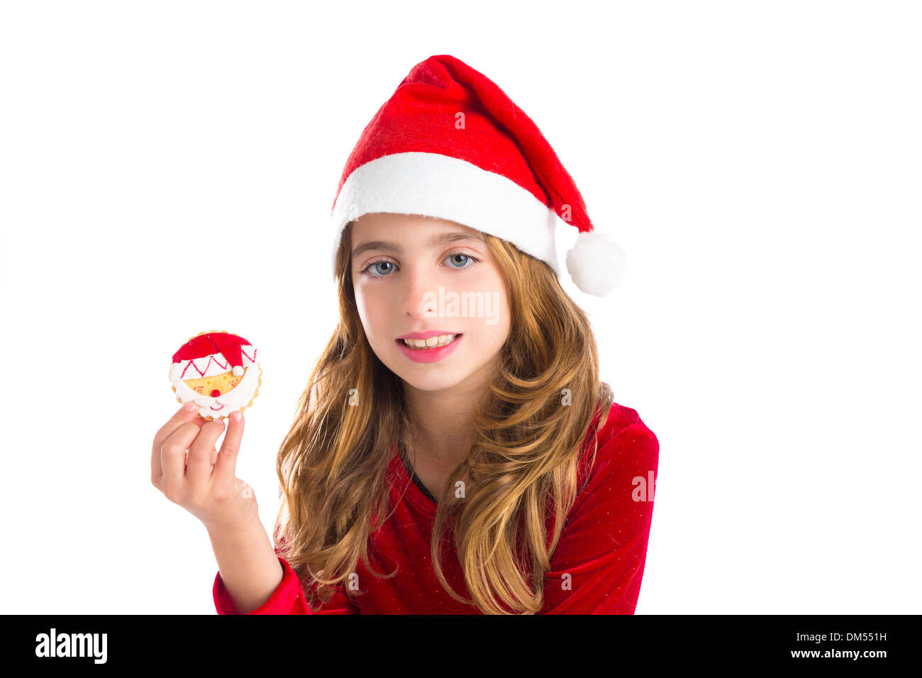 Christmas kid girl holding Xmas Santa cookie isolated on white background Stock Photo