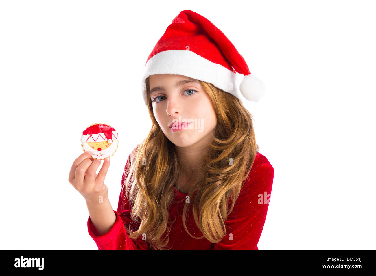Christmas kid girl holding Xmas Santa cookie isolated on white background Stock Photo