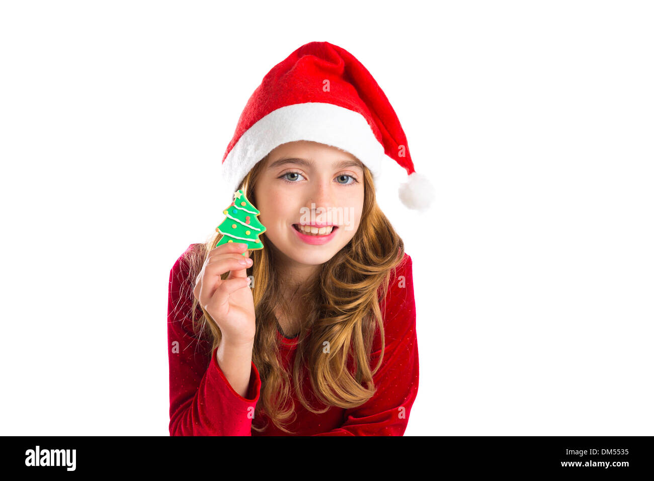 Christmas kid girl holding Xmas tree cookie isolated on white background Stock Photo