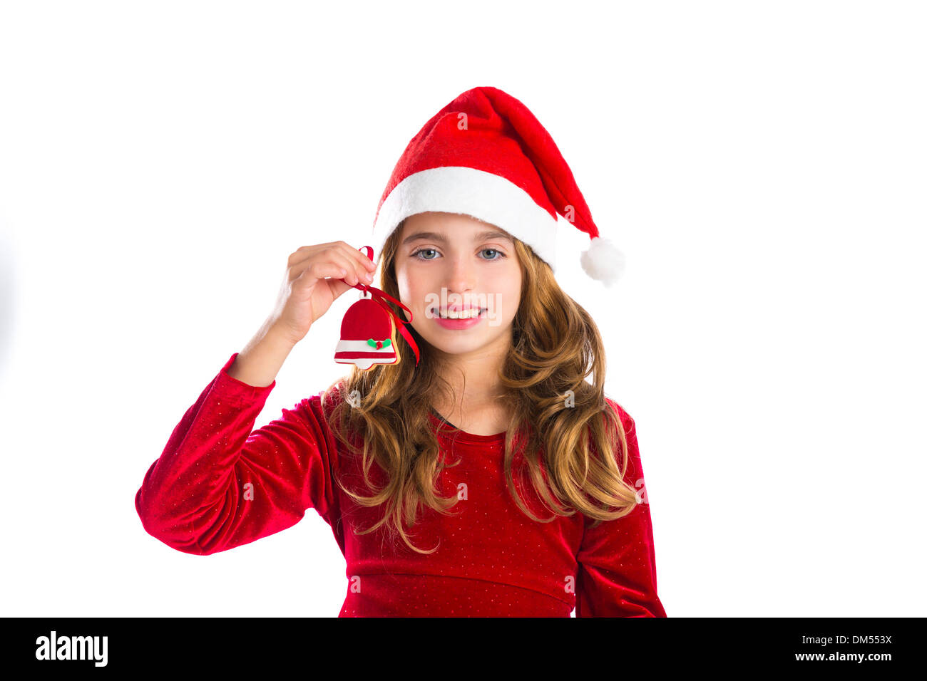 Christmas red bell cookie and Xmas dress kid girl isolated on white background Stock Photo